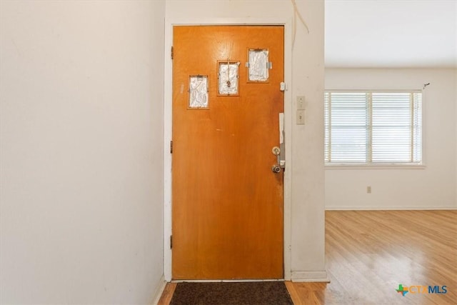 302 W Upshaw Ave, Temple, TX 76501 - entryway with baseboards and wood finished floors