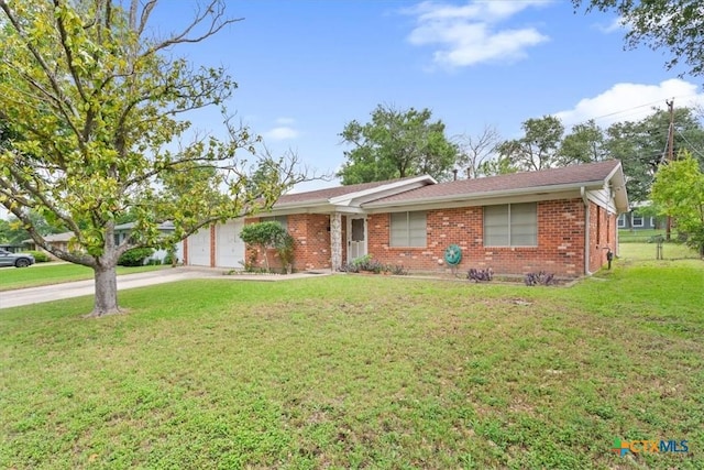 302 W Upshaw Ave, Temple, TX 76501 - single story home featuring concrete driveway, brick siding, a garage, and a front yard