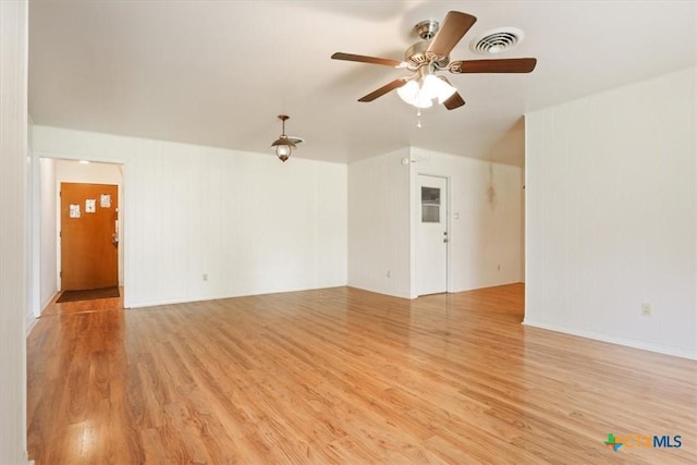 302 W Upshaw Ave, Temple, TX 76501 - unfurnished living room featuring light wood-type flooring and a ceiling fan