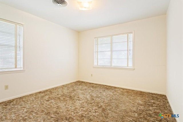 302 W Upshaw Ave, Temple, TX 76501 - carpeted empty room with plenty of natural light and baseboards