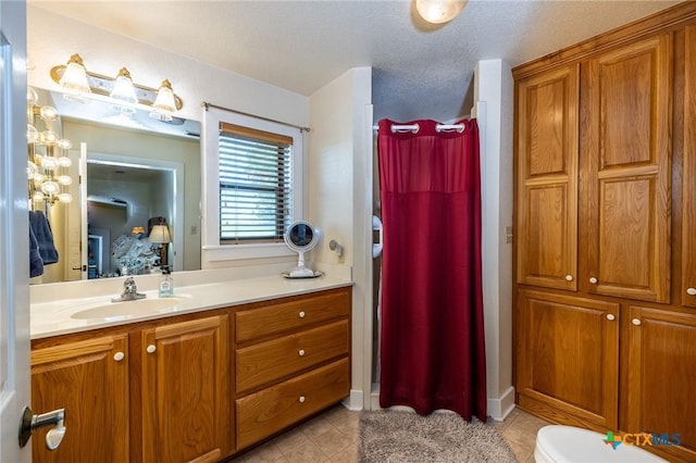 6589 State Highway 304, Harwood, TX 78632 - full bathroom with vanity, tile patterned floors, a shower with curtain, and toilet