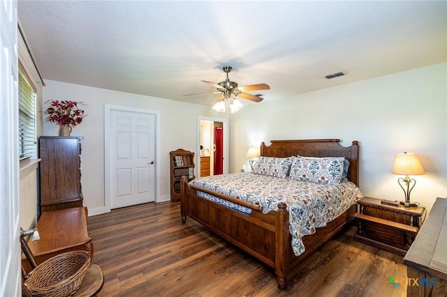 6589 State Highway 304, Harwood, TX 78632 - bedroom with wood finished floors, a ceiling fan, baseboards, and ensuite bath