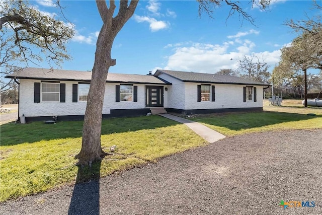 ranch-style house with a front lawn