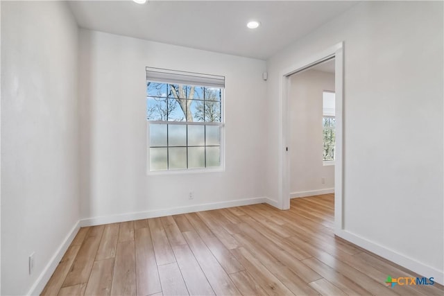 empty room with light hardwood / wood-style floors