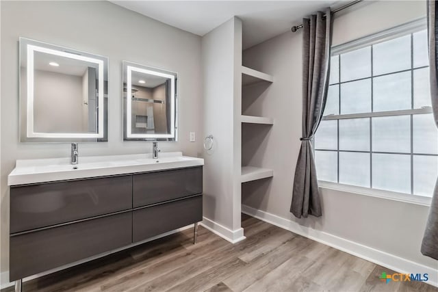 bathroom with wood-type flooring and vanity