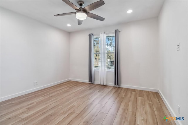 empty room with light hardwood / wood-style floors and ceiling fan