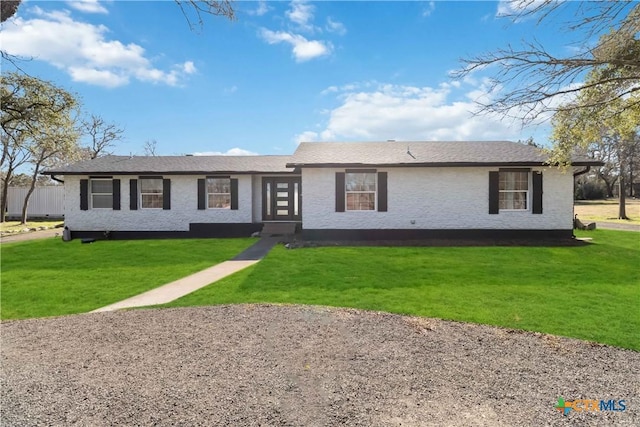 single story home featuring a front lawn