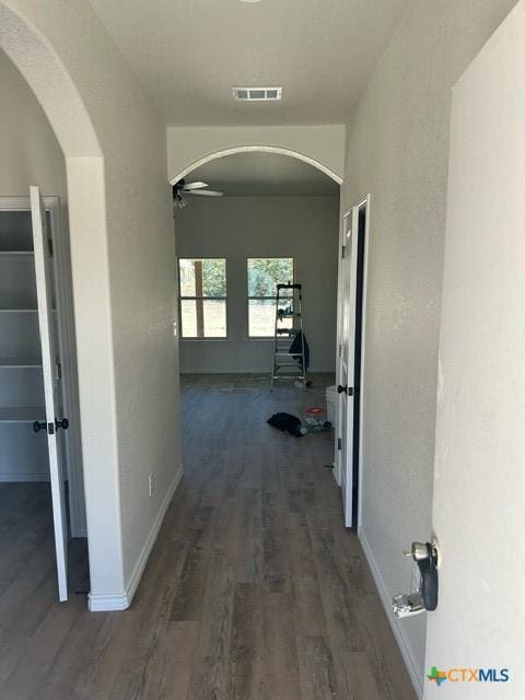 hall with dark hardwood / wood-style floors