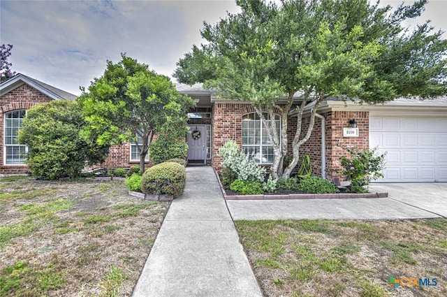 2109 Southport Dr, Killeen, TX 76542 - view of property hidden behind natural elements with brick siding and a garage