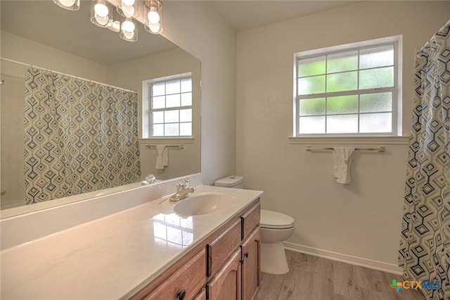 2109 Southport Dr, Killeen, TX 76542 - full bathroom featuring vanity, wood finished floors, a chandelier, and a shower with curtain