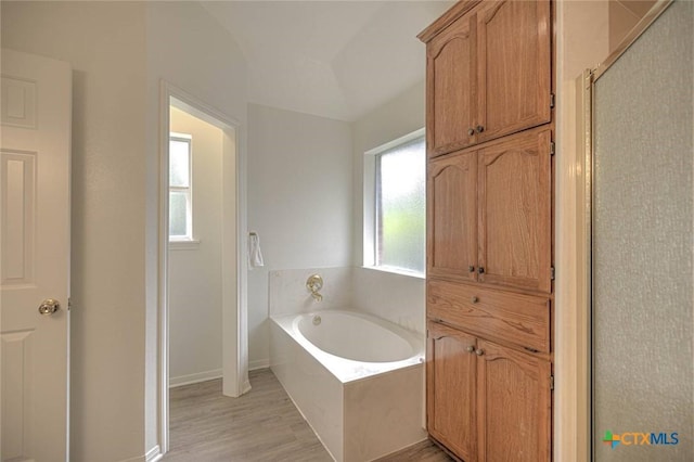 2109 Southport Dr, Killeen, TX 76542 - full bathroom with a garden tub, wood finished floors, and a shower stall