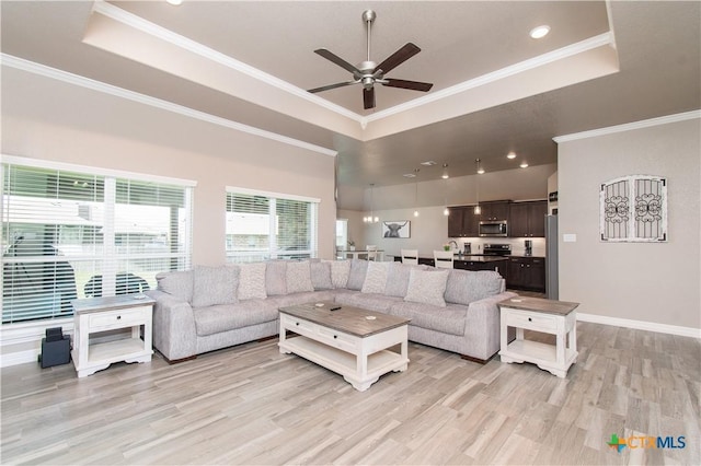 503 Willow Dr, Troy, TX 76579 - living area featuring a tray ceiling, ceiling fan, light wood-style floors, crown molding, and recessed lighting