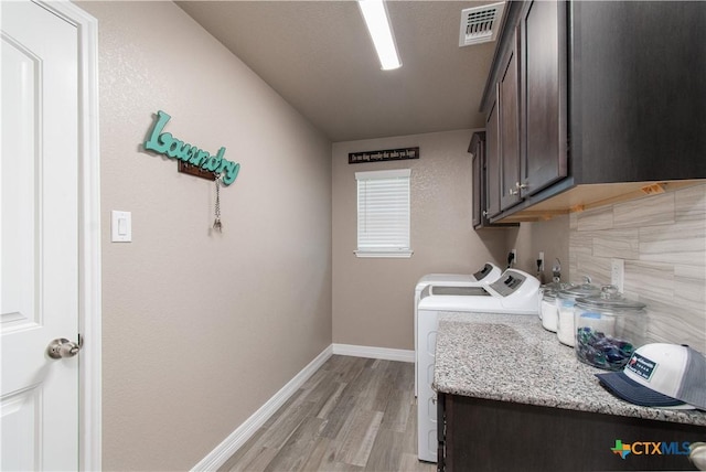 503 Willow Dr, Troy, TX 76579 - laundry room featuring cabinet space, separate washer and dryer, and light wood finished floors