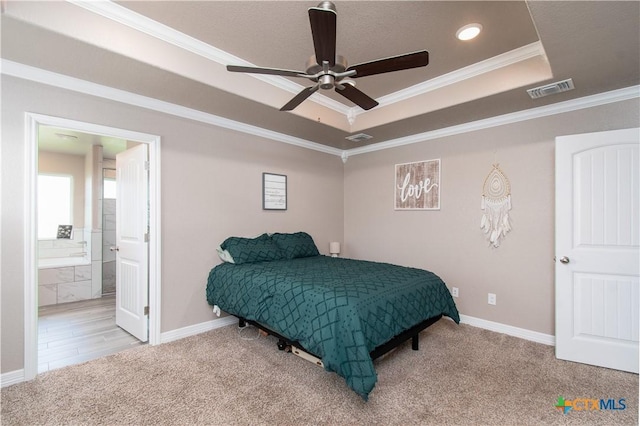 503 Willow Dr, Troy, TX 76579 - bedroom with a tray ceiling, carpet, ornamental molding, ensuite bathroom, and ceiling fan