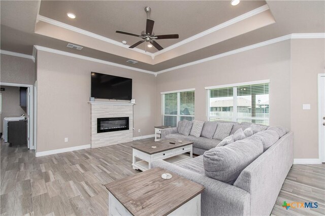 503 Willow Dr, Troy, TX 76579 - living room featuring a tray ceiling, a ceiling fan, light wood-style flooring, crown molding, and recessed lighting