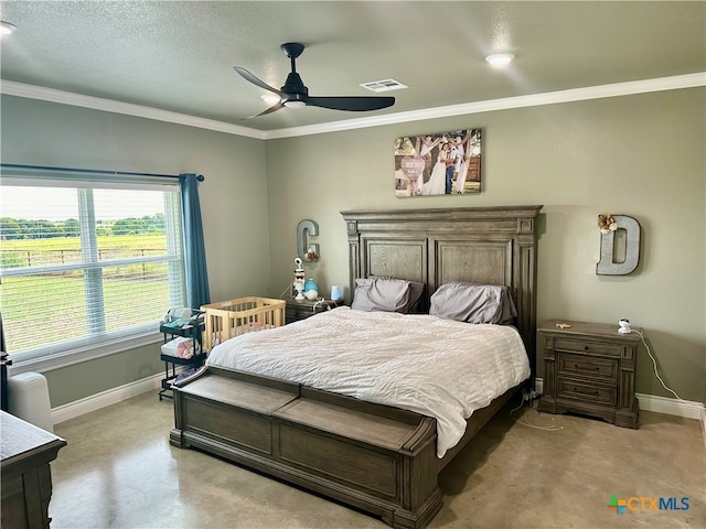 bedroom featuring ornamental molding, a textured ceiling, and ceiling fan