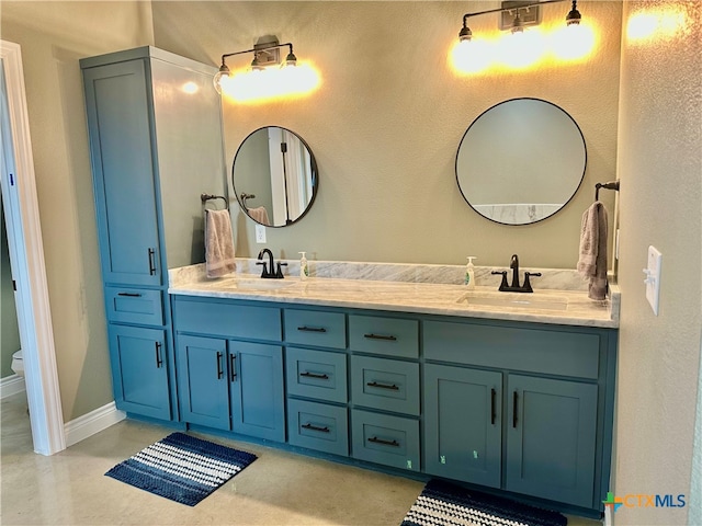 bathroom with toilet and vanity