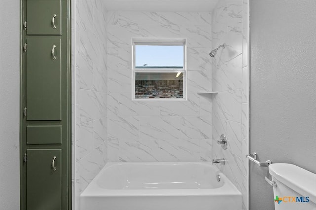 3126 Glenwood Dr, Temple, TX 76502 - bathroom featuring toilet, a textured wall, and  shower combination