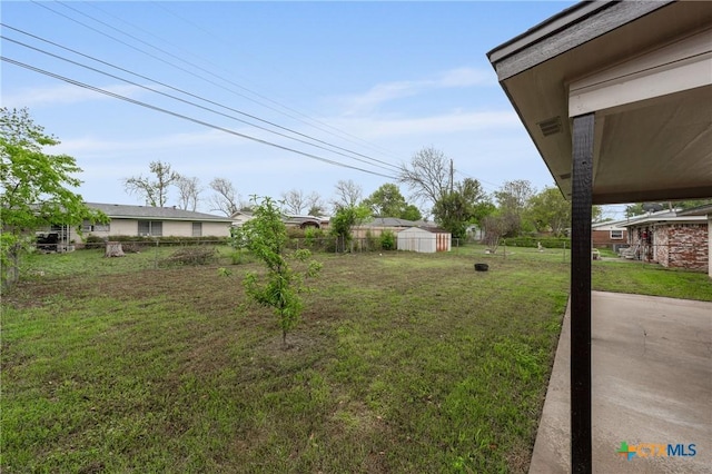 3126 Glenwood Dr, Temple, TX 76502 - view of yard with an outdoor structure, fence, and a shed
