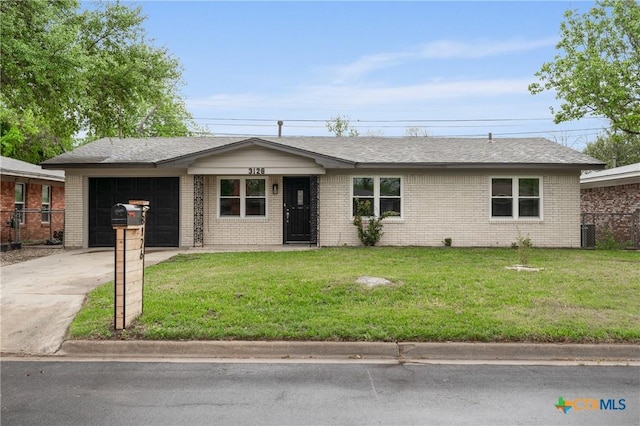 3126 Glenwood Dr, Temple, TX 76502 - ranch-style home featuring a front yard, fence, brick siding, a garage, and concrete driveway