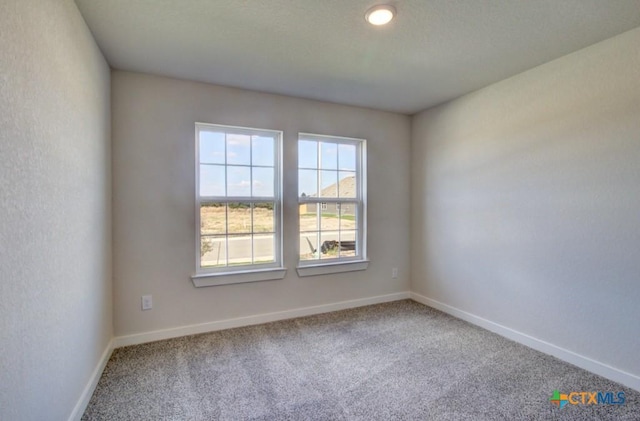 911 Cloud Sky Rd, New Braunfels, TX 78130 - spare room featuring carpet flooring and baseboards