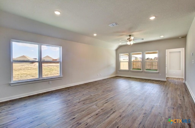 911 Cloud Sky Rd, New Braunfels, TX 78130 - empty room featuring a ceiling fan, dark wood-type flooring, a textured ceiling, vaulted ceiling, and recessed lighting