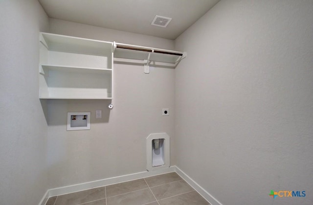 911 Cloud Sky Rd, New Braunfels, TX 78130 - laundry area with hookup for an electric dryer, hookup for a washing machine, and tile patterned flooring