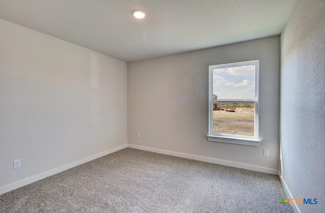 911 Cloud Sky Rd, New Braunfels, TX 78130 - carpeted spare room featuring baseboards