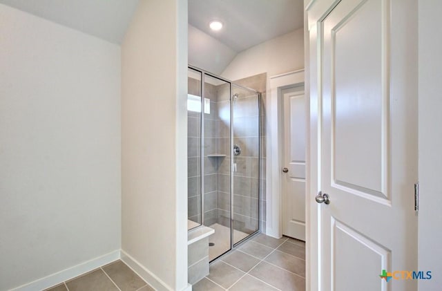 911 Cloud Sky Rd, New Braunfels, TX 78130 - full bathroom with tile patterned floors, a shower stall, and vaulted ceiling