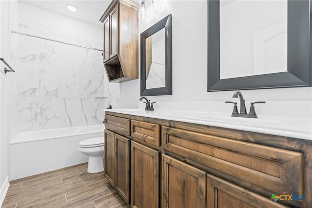 full bathroom featuring vanity, shower / bath combination, and toilet