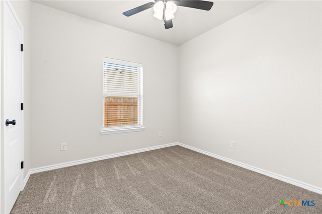 spare room featuring carpet floors and ceiling fan