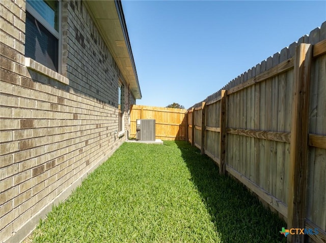 view of yard featuring central AC