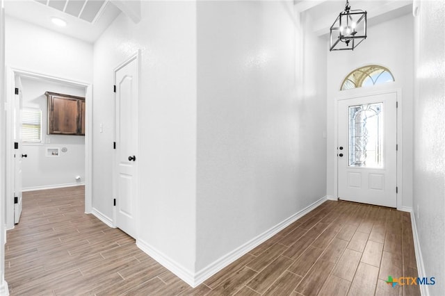 entryway featuring a chandelier