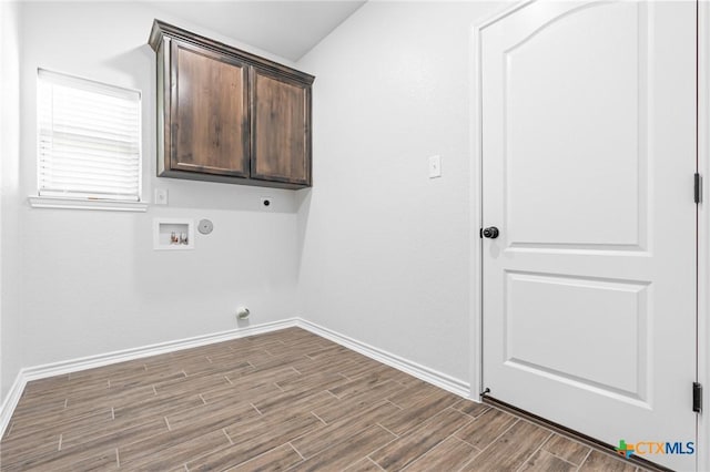 laundry room with cabinets, washer hookup, hookup for a gas dryer, and electric dryer hookup