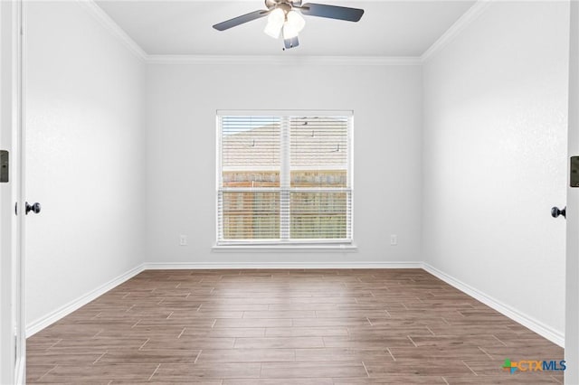 unfurnished room featuring ceiling fan and ornamental molding