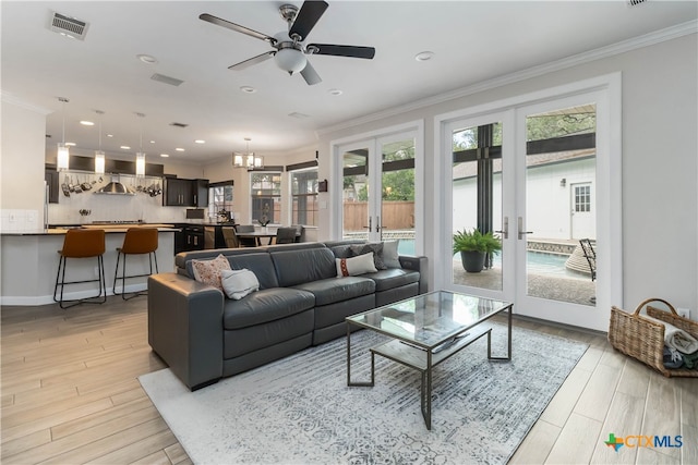 3836 Newland Ct, Round Rock, TX 78681 - living room featuring french doors, ornamental molding, ceiling fan, light wood finished floors, and recessed lighting