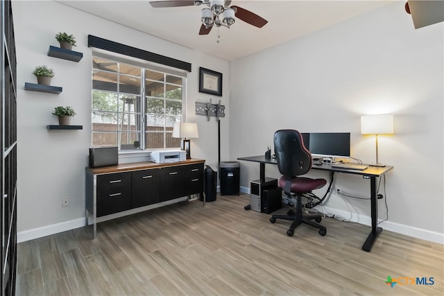 3836 Newland Ct, Round Rock, TX 78681 - home office featuring a ceiling fan, light wood-style flooring, and baseboards