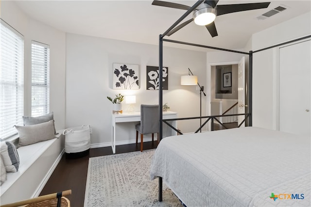 3836 Newland Ct, Round Rock, TX 78681 - bedroom featuring wood finished floors, a ceiling fan, and baseboards