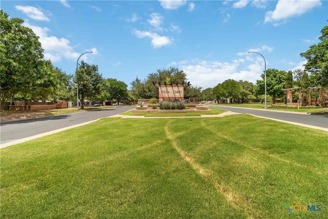 3836 Newland Ct, Round Rock, TX 78681 - view of asphalt road featuring street lights