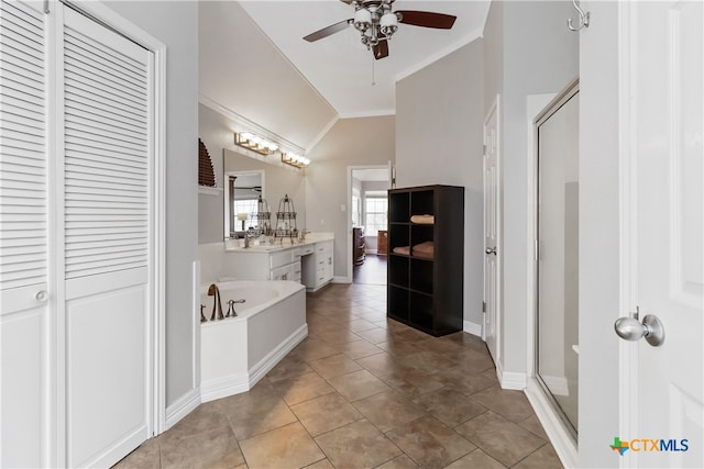3836 Newland Ct, Round Rock, TX 78681 - bathroom with crown molding, ceiling fan, a stall shower, a bath, and a closet