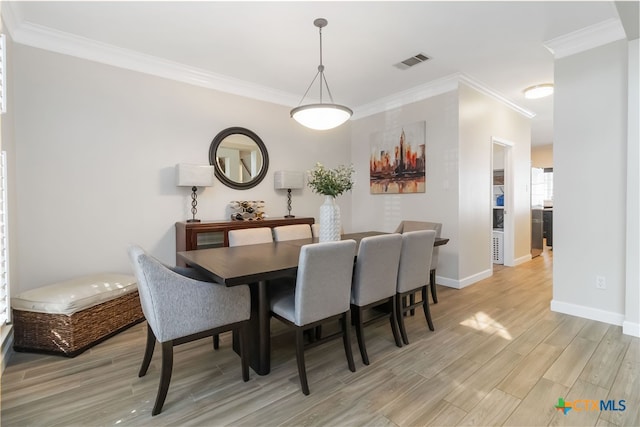 3836 Newland Ct, Round Rock, TX 78681 - dining room featuring ornamental molding, light wood-style flooring, and baseboards