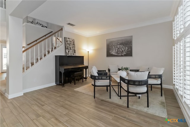3836 Newland Ct, Round Rock, TX 78681 - living room featuring stairway, wood finished floors, crown molding, and baseboards