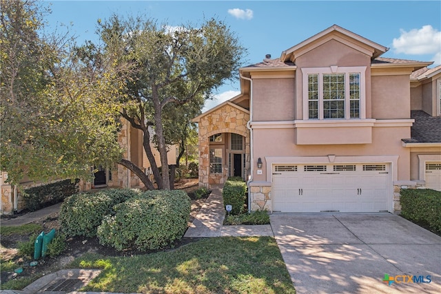 view of front of property with a garage