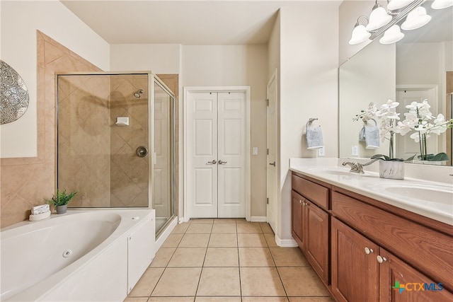 bathroom featuring tile patterned floors, vanity, and independent shower and bath