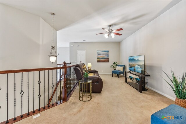 sitting room featuring carpet flooring and ceiling fan