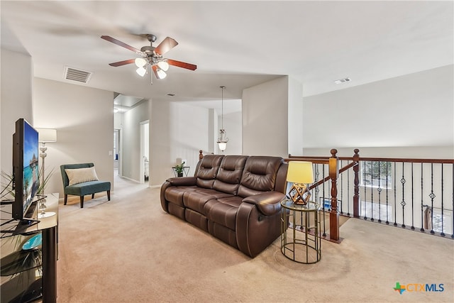 living room with carpet floors and ceiling fan