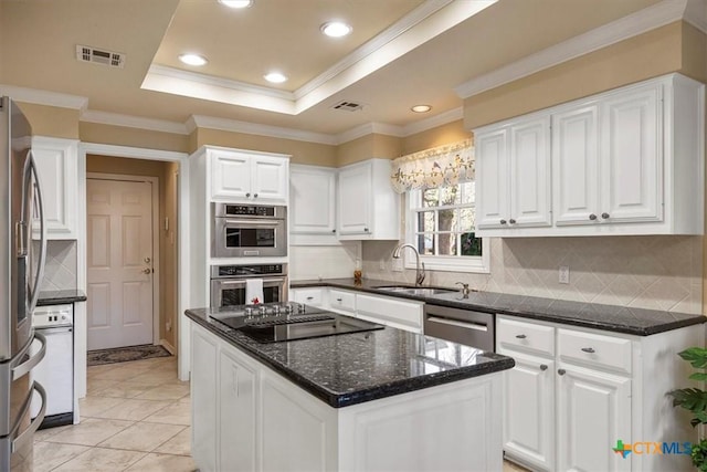 2113 Highland Dr, Salado, TX 76571 - kitchen featuring a sink, stainless steel appliances, white cabinetry, decorative backsplash, and crown molding