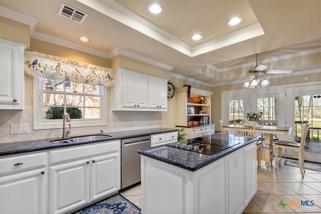 2113 Highland Dr, Salado, TX 76571 - kitchen with a sink, dishwasher, black electric cooktop, a kitchen island, and white cabinetry