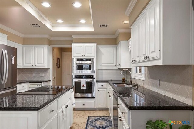 2113 Highland Dr, Salado, TX 76571 - kitchen featuring a sink, appliances with stainless steel finishes, a tray ceiling, white cabinets, and recessed lighting