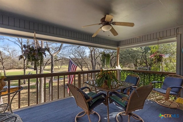 2113 Highland Dr, Salado, TX 76571 - sunroom / solarium featuring a ceiling fan, view of golf course, and outdoor dining area
